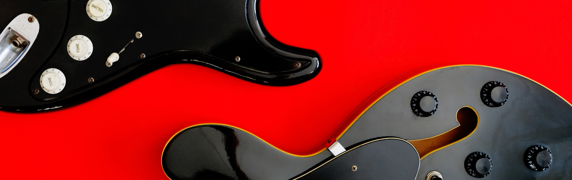 electric-guitar-on-a-red-background-2023-11-27-05-08-53-utc